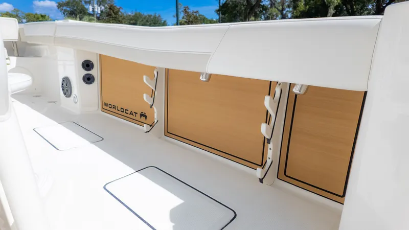 Slide: The Image of The image shows the deck of a World Cat 265CC boat with storage compartments and speakers. - 7