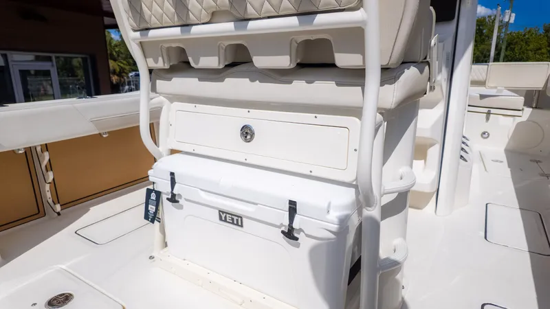 Slide: The Image of The image shows the cockpit of a World Cat 265CC boat with a cooler. - 9