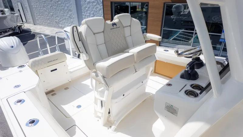 Slide: The Image of 2026 World Cat 265CC: Luxurious seating and modern helm on a sleek boat. - 9