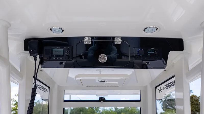 Slide: The Image of Interior view of a World Cat 265CC featuring modern electronics and communication devices. - 19