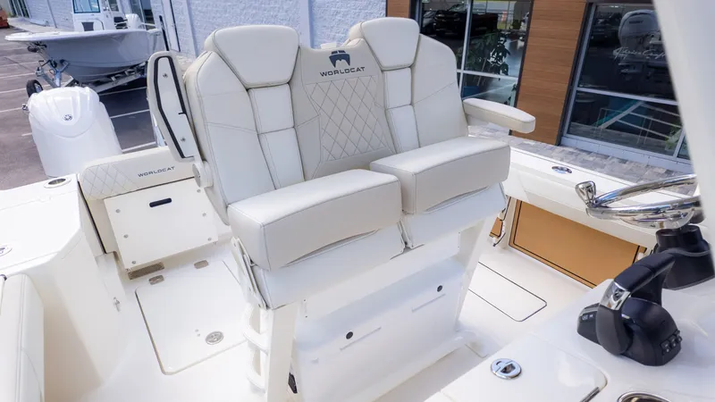 Slide: The Image of The 2026 World Cat 265CC features luxurious padded seating and a modern helm station. - 18