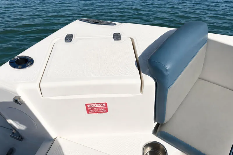 Slide: The Image of 2008 Scout 222 Abaco boat interior with cushioned seating and storage compartment. - 13