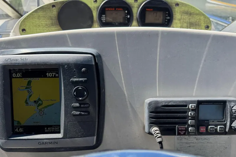 Slide: The Image of Dashboard of a 2008 Scout 222 Abaco boat with GPS and radio equipment. - 19