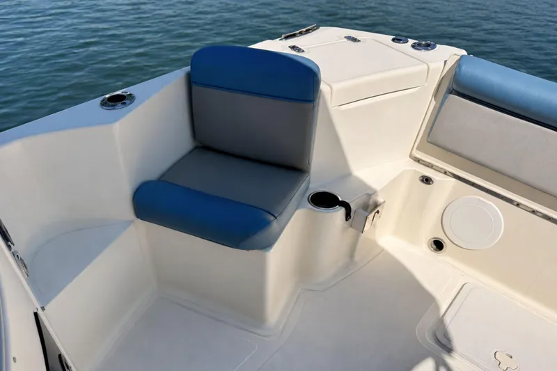 Slide: The Image of Interior seating of 2008 Scout 222 Abaco boat with blue and gray cushions. - 14