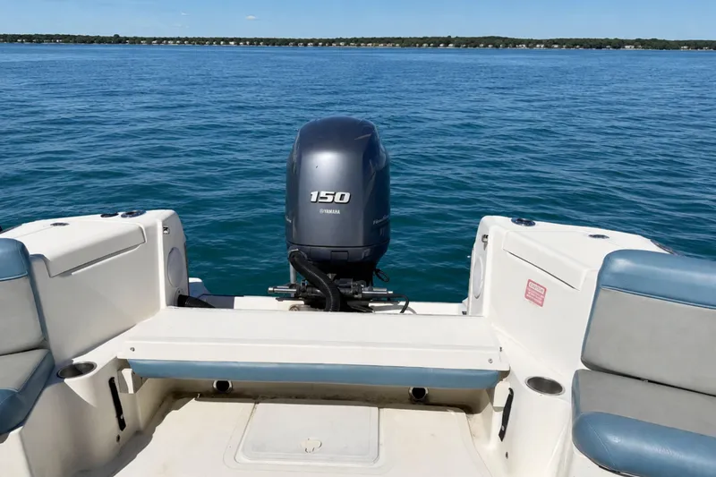 Slide: The Image of 2008 Scout 222 Abaco boat with Yamaha 150 engine on calm blue water. - 11