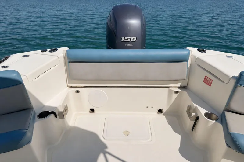 Slide: The Image of 2008 Scout 222 Abaco boat interior with Yamaha 150 engine on calm water. - 10