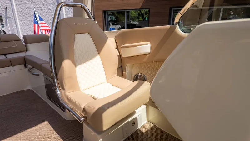 Slide: The Image of The interior of a 2025 Chris-Craft Launch 28 GT with a beige seat and elegant details. - 17