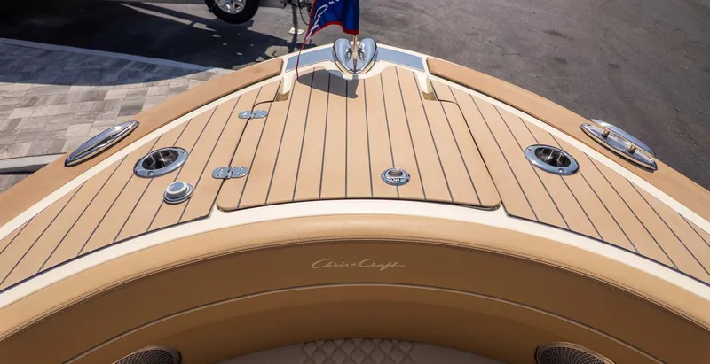 Slide: The Image of Bow of a Chris-Craft Launch 28 GT with teak decking and stainless steel fittings. - 23