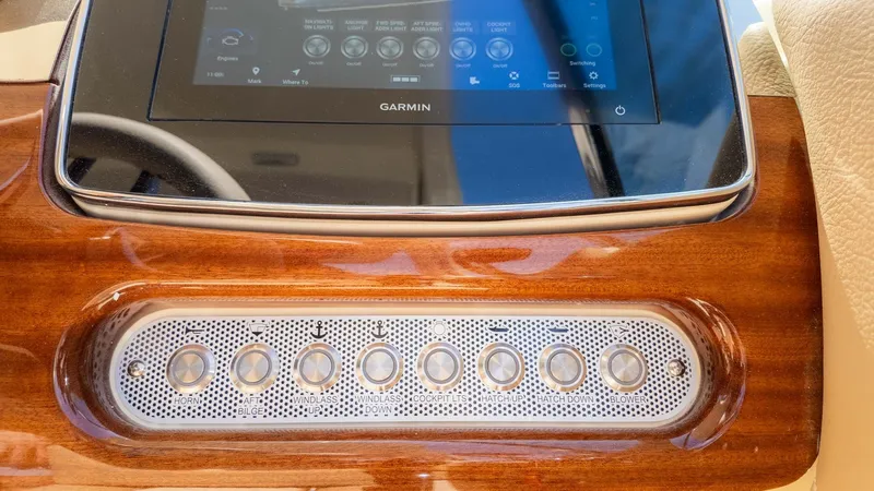 Slide: The Image of The image shows a sleek dashboard with a Garmin screen and stylish controls. - 30