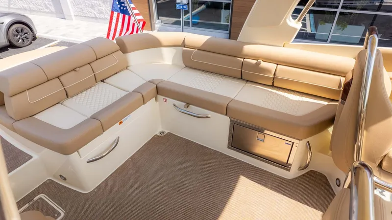 Slide: The Image of The image shows the cockpit of a Chris-Craft Launch 28 GT with beige upholstery and an American flag motif. - 9