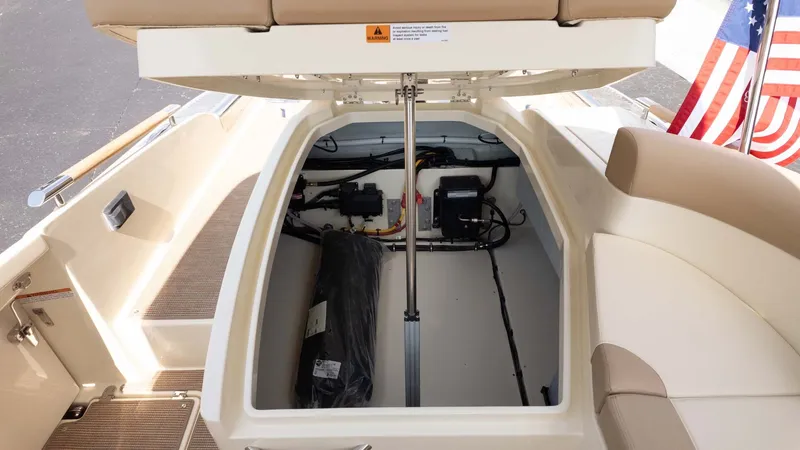Slide: The Image of Storage compartment in the stern of a Chris-Craft Launch 28 GT with open cover and American flag. - 13