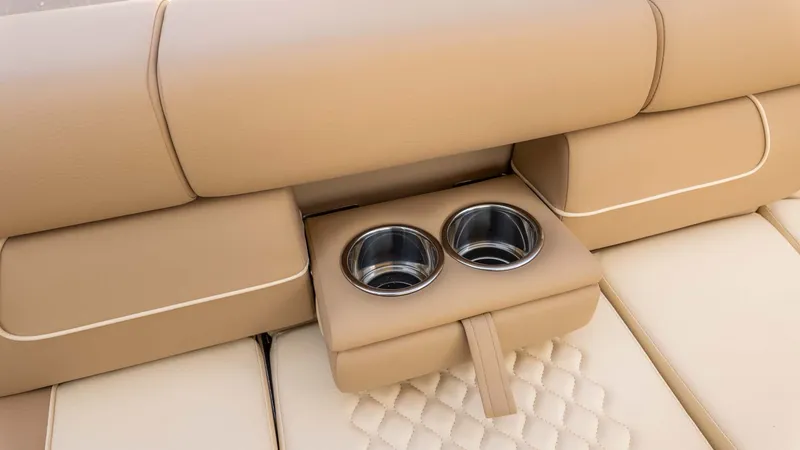 Slide: The Image of Close-up of a beige boat seat with two stainless steel cup holders. - 23