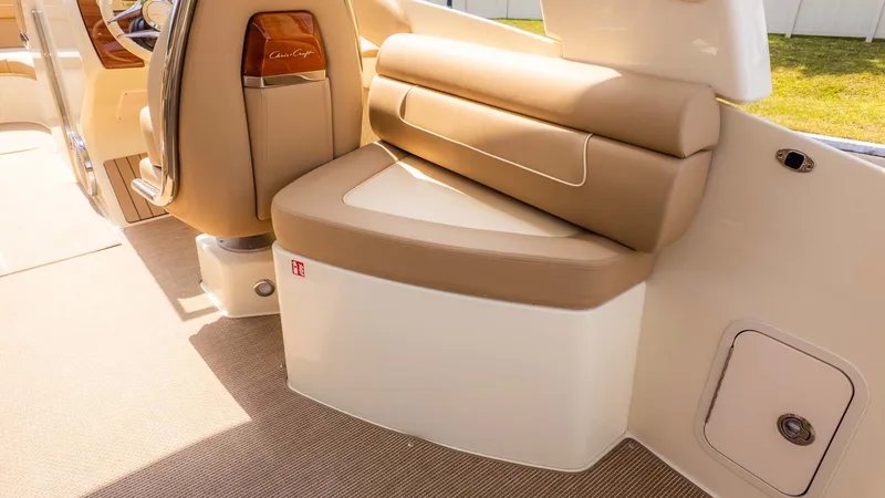 Slide: The Image of Interior of a Chris-Craft Launch 28 GT with beige upholstered seating and sleek details. - 6