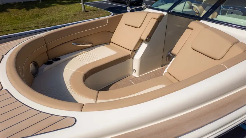 Slide: The Image of The image shows the interior of a 2025 Chris-Craft Launch 28 GT with beige seating. - 11