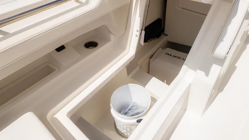 Slide: The Image of Interior view of a boat with storage compartments and a bucket. - 35