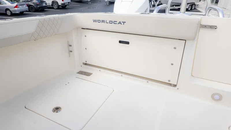 Slide: The Image of Aft area of a World Cat 280 Dual Console boat with storage compartment. - 10