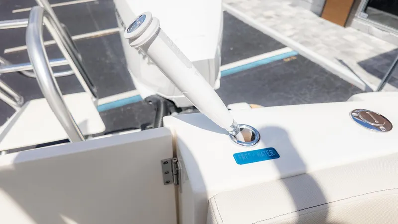 Slide: The Image of Close-up of a boat part with a faucet and a "Fresh Water" label. - 14