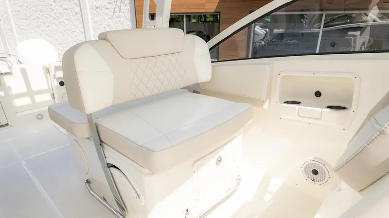 Slide: The Image of Interior view of a boat with beige and white seating, surrounded by sleek details. - 21