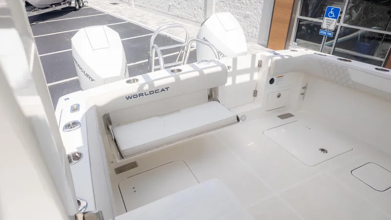 Slide: The Image of The image shows the stern of a World Cat 280 Dual Console boat with two engines. - 7