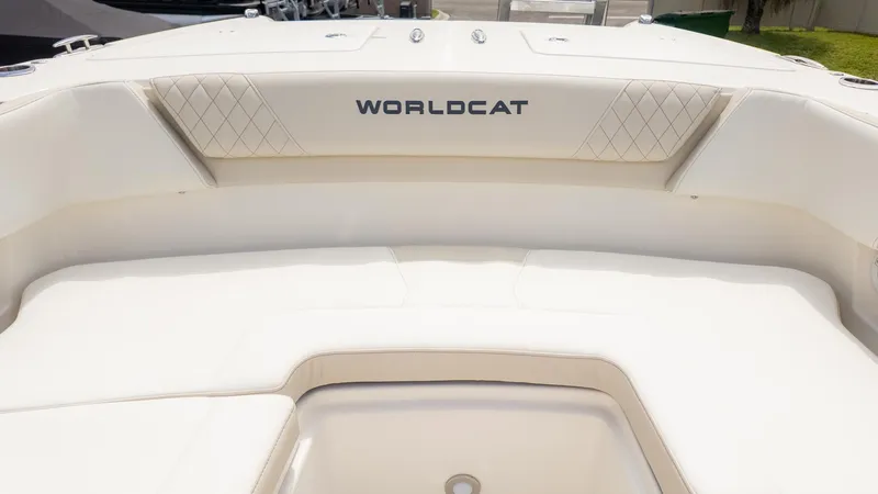 Slide: The Image of Interior view of a World Cat 280 Dual Console boat with cushioned seating. - 31
