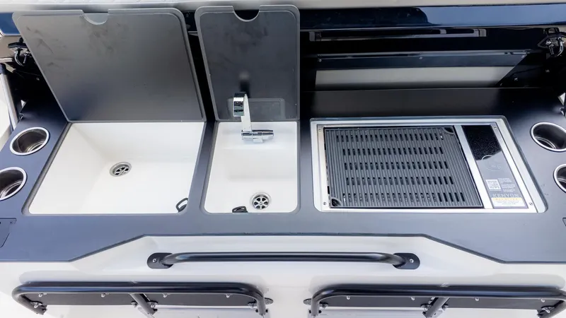 Slide: The Image of Boat kitchenette with sink and grill. - 21