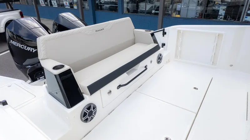 Slide: The Image of The image shows the stern of a Navan S30 boat with a bench seat and speakers. - 8