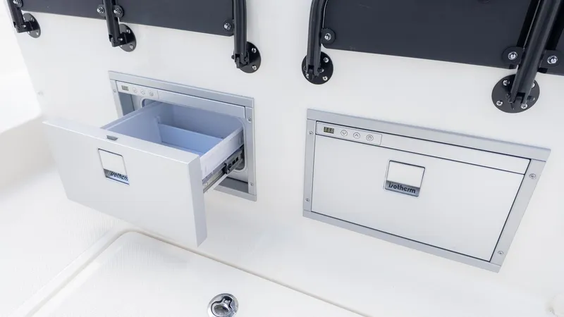 Slide: The Image of A boat with two built-in refrigerators, one open, one closed. - 23
