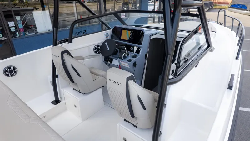 Slide: The Image of The image shows the cockpit of a 2026 Navan S30 boat with modern seating and controls. - 11