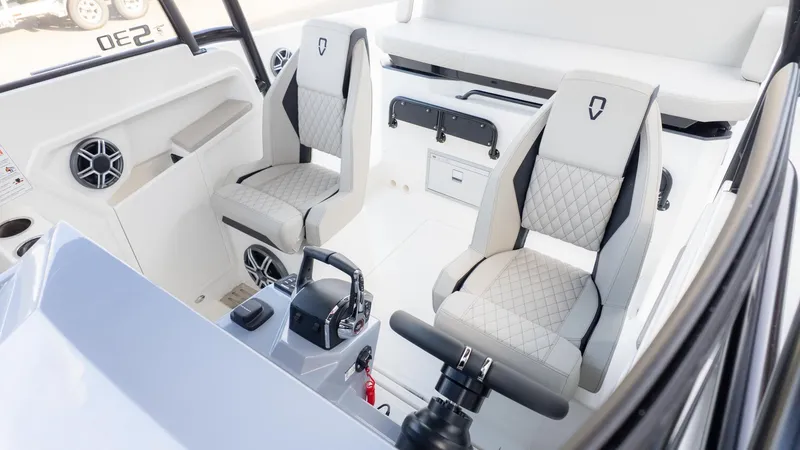Slide: The Image of Interior of the 2026 Navan S30 with two cushioned seats and a steering console. - 30