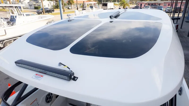Slide: The Image of The image shows the roof of a modern boat with large windows and an LED light. - 25