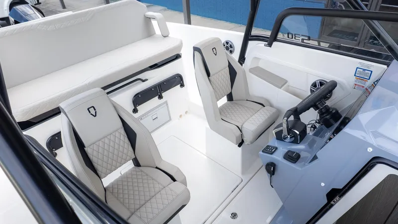 Slide: The Image of The image shows the cockpit of a Navan S30 boat with two cushioned seats and a helm station. - 10