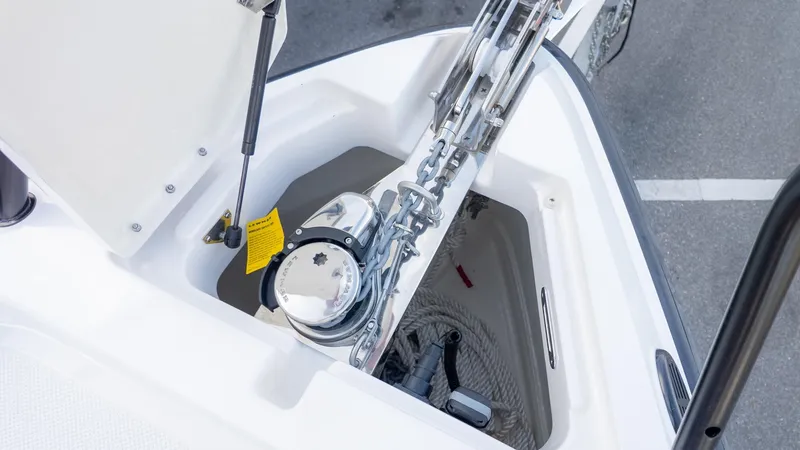 Slide: The Image of Close-up of an anchor locker with chain and windlass on a boat. - 13