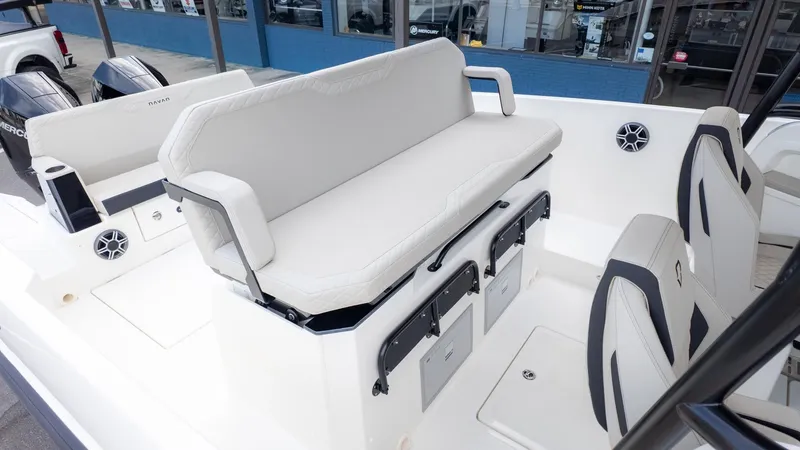 Slide: The Image of The image shows the interior of a 2026 Navan S30 boat with white seating. - 8