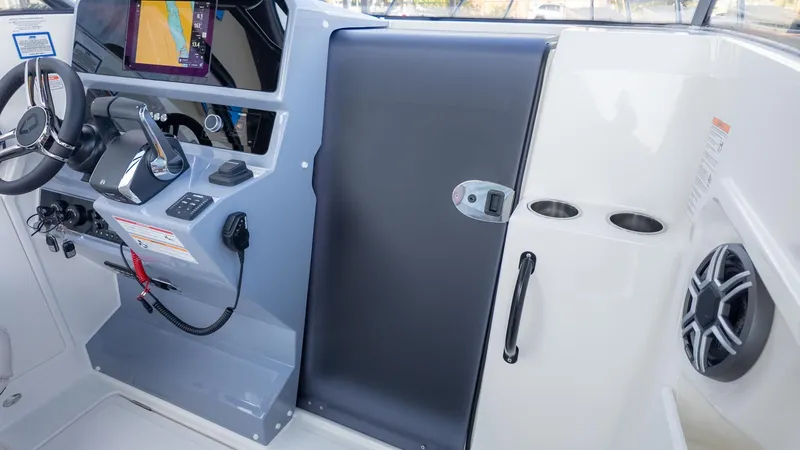 Slide: The Image of The image shows the cockpit of a Navan S30 boat with modern controls and electronics. - 30