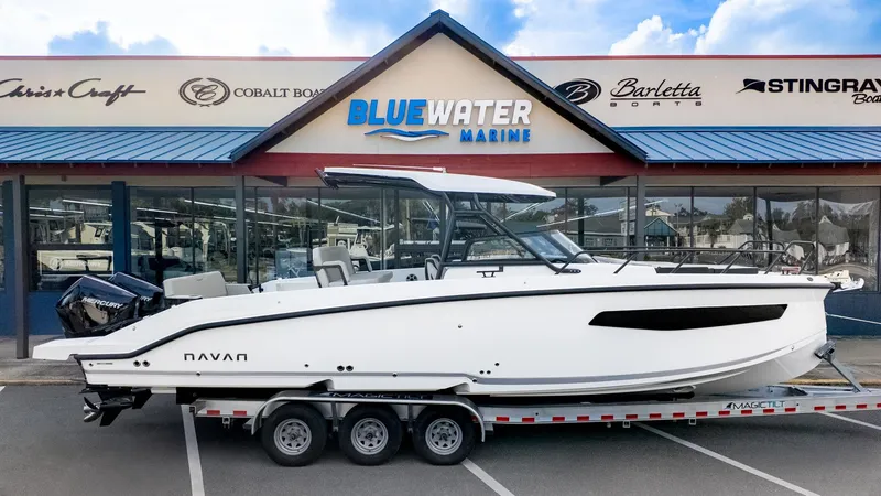 Slide: The Image of Navan S30 2026 on a trailer in front of a boat dealership. - 36