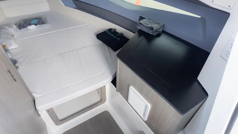 Slide: The Image of Interior of the Navan S30 with bed and storage area. - 33