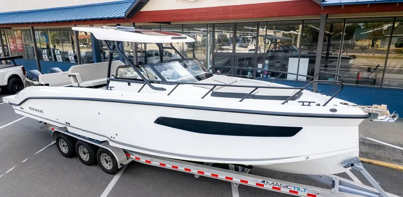 Slide: The Image of A modern motorboat on a trailer in front of a building. It features a sleek design. - 38