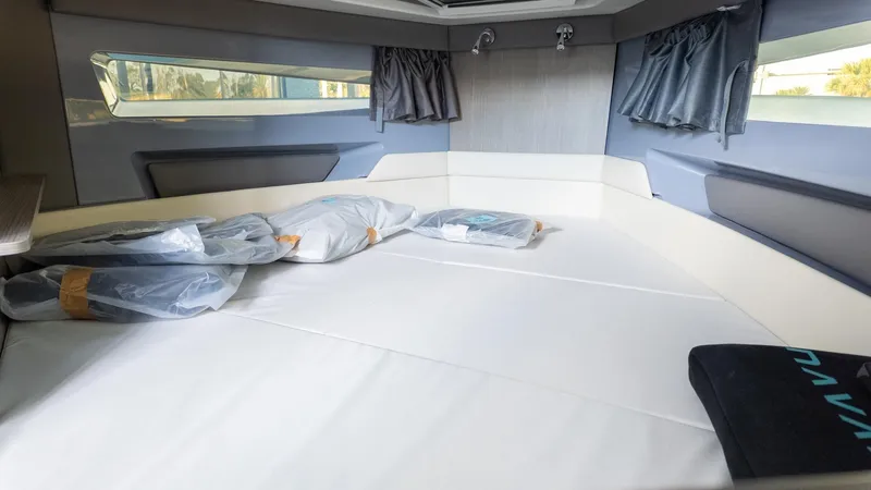 Slide: The Image of Interior of a modern boat cabin with large windows and a comfortable bed. - 32