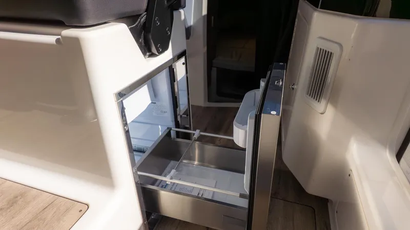 Slide: The Image of Galley area with open fridge and drawers. - 20