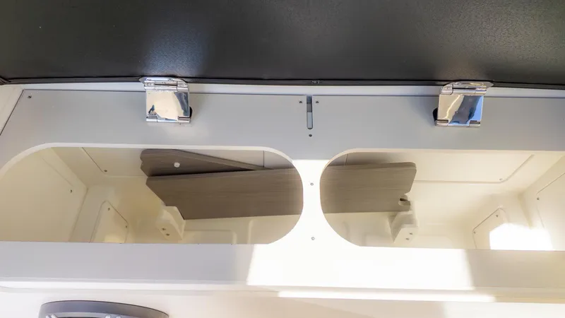 Slide: The Image of Interior view of a boat cabinet with two compartments and metal latches. - 17