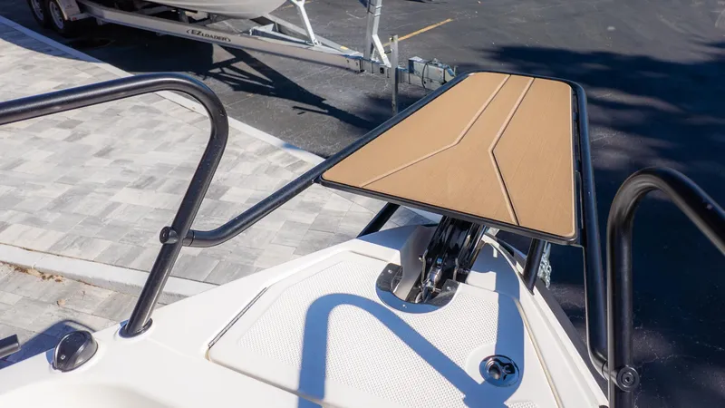Slide: The Image of Bow of a boat with teak deck and stainless steel railing. - 33