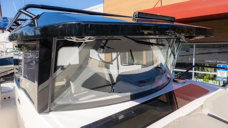 Slide: The Image of The 2026 Navan C30 features a modern design with large windows and a sleek black roof. - 11