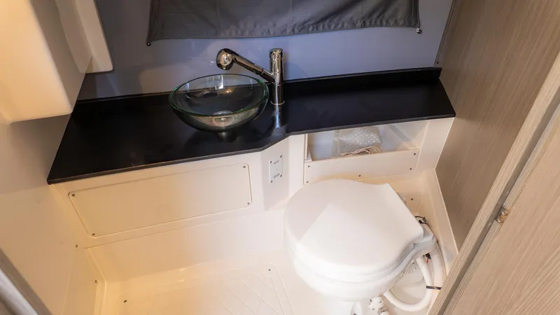Slide: The Image of Modern bathroom with glass sink and toilet in a boat. - 32
