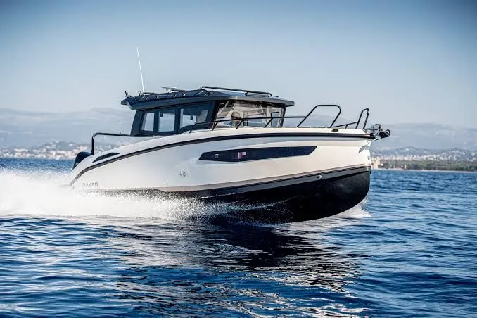 Slide: The Image of A modern motorboat speeding across the water, featuring a closed cabin and sleek design. - 37