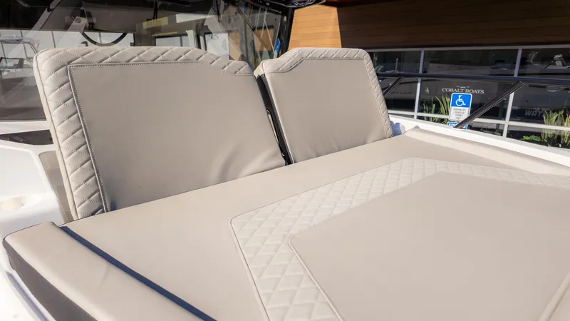 Slide: The Image of The 2026 Navan C30 features a sleek, padded sun deck with a quilted design. - 34