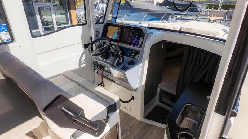Slide: The Image of Interior of a modern boat with helm, seating, and cabin. - 22