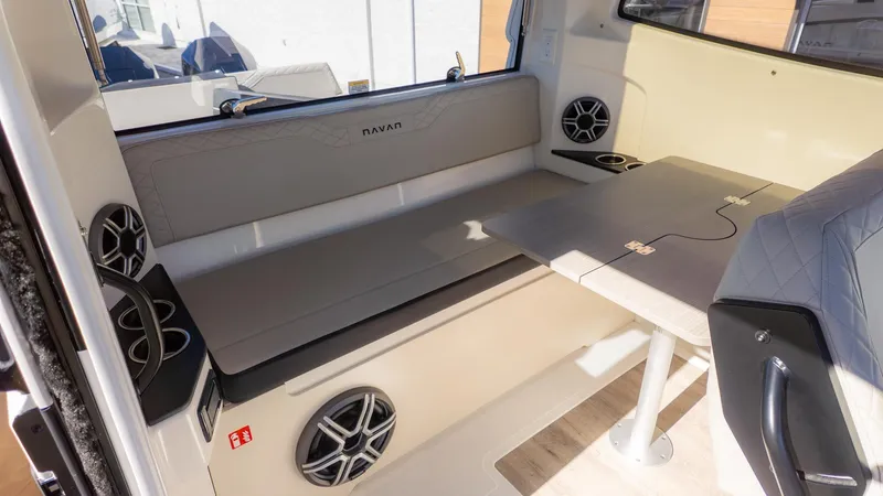 Slide: The Image of Interior of the Navan C30 with gray seating and table. - 14