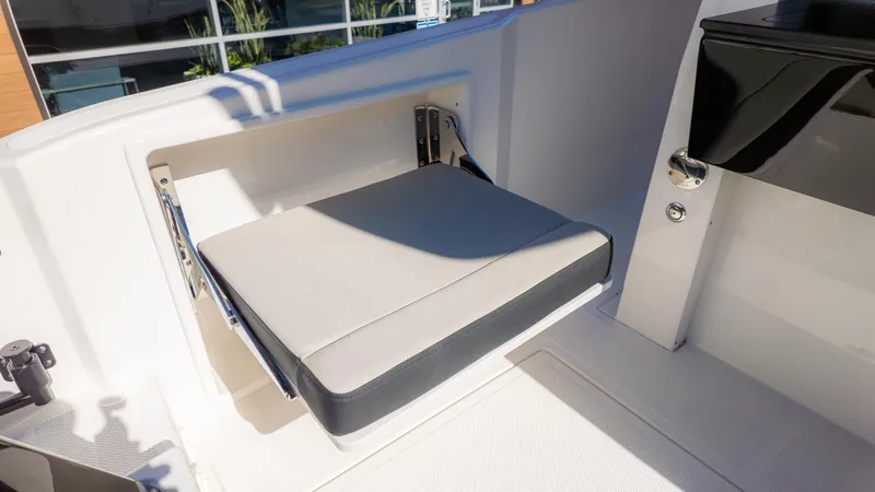 Slide: The Image of A modern boat with a foldable seat in the cockpit area. - 13