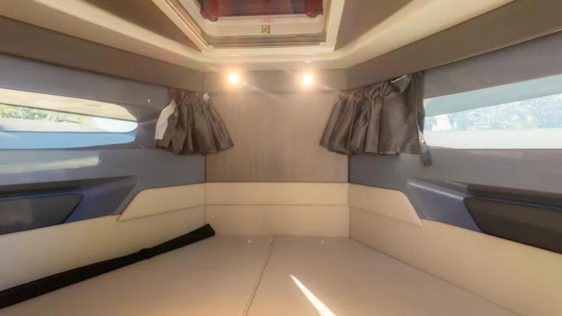 Slide: The Image of Interior of the 2026 Navan C30 with cushioned seating and windows. - 28