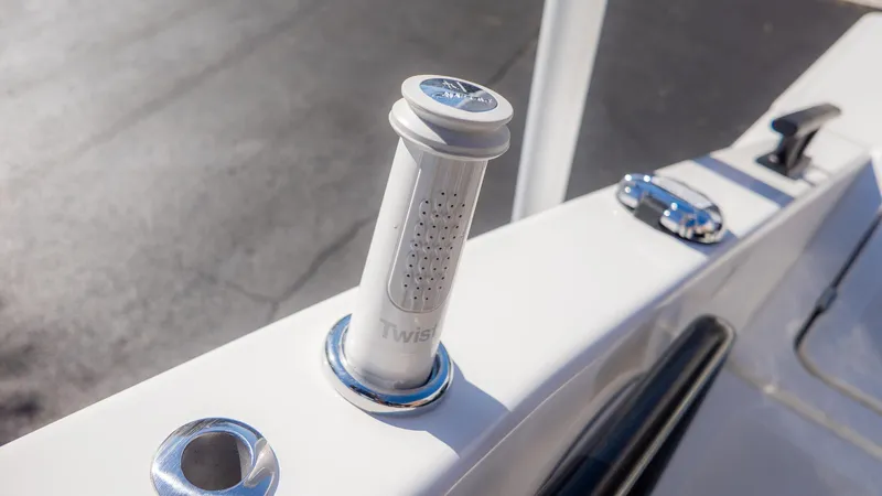 Slide: The Image of Close-up of a boat part featuring a white cylindrical handle and metal fittings. - 4